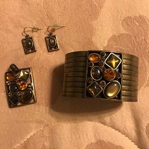Beautiful bronzed cuff, pendant and earrings.